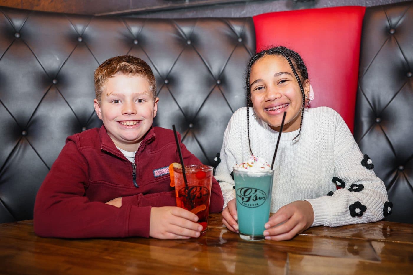 Kids cheering with drinks at a birthday party