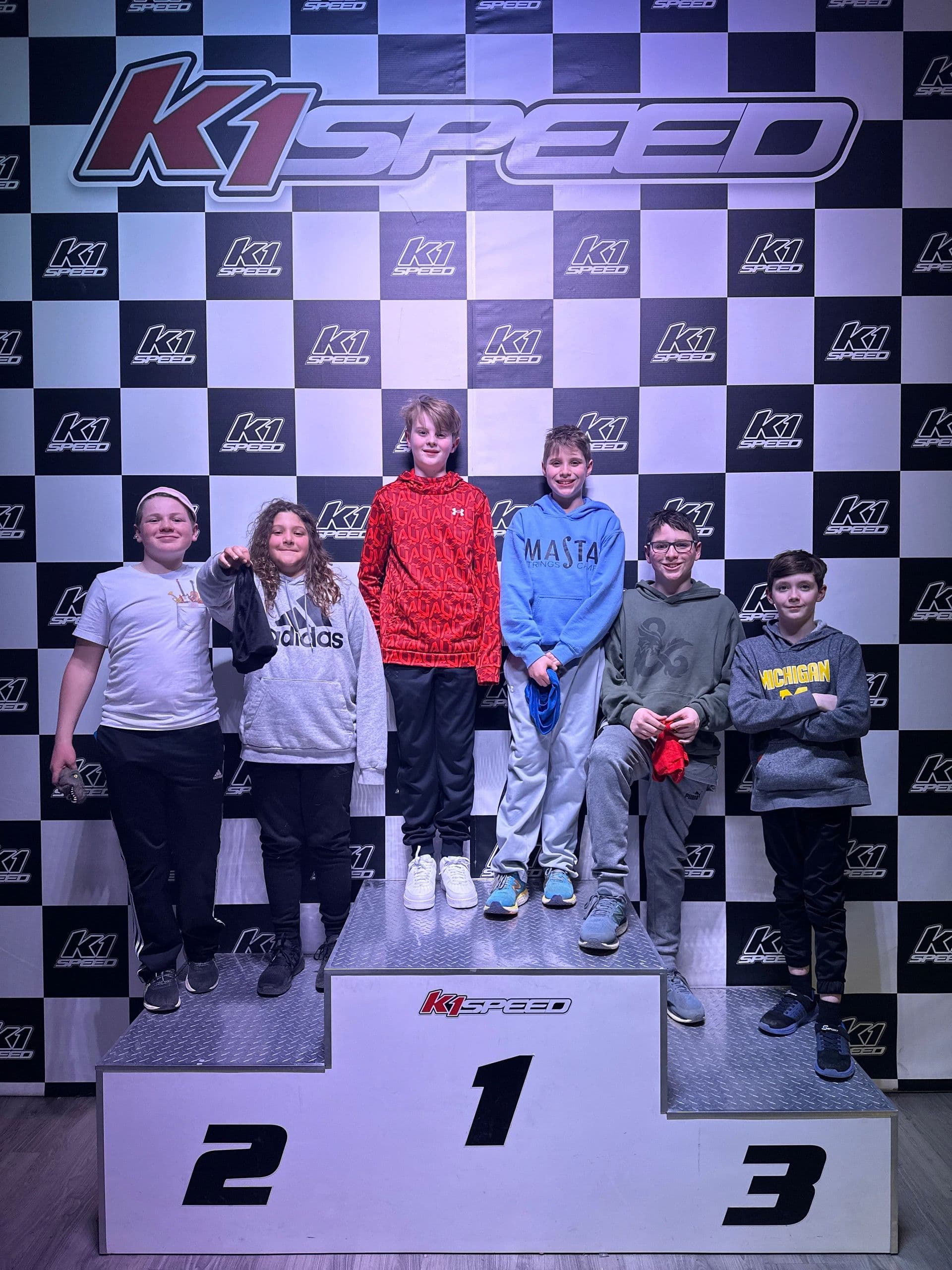 Young racers on the K1 Speed podium
